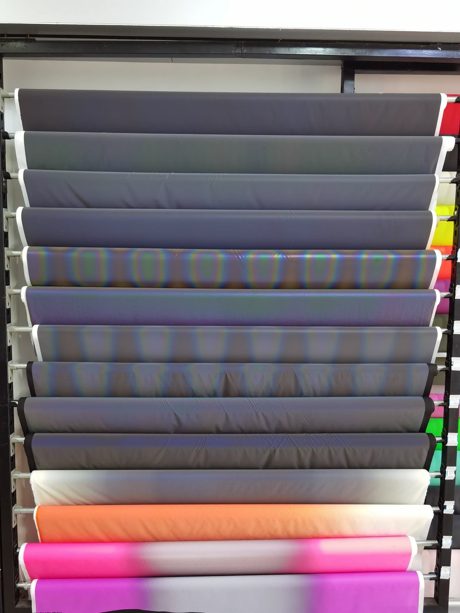 Reflective and surface-effect material samples stored on rolls