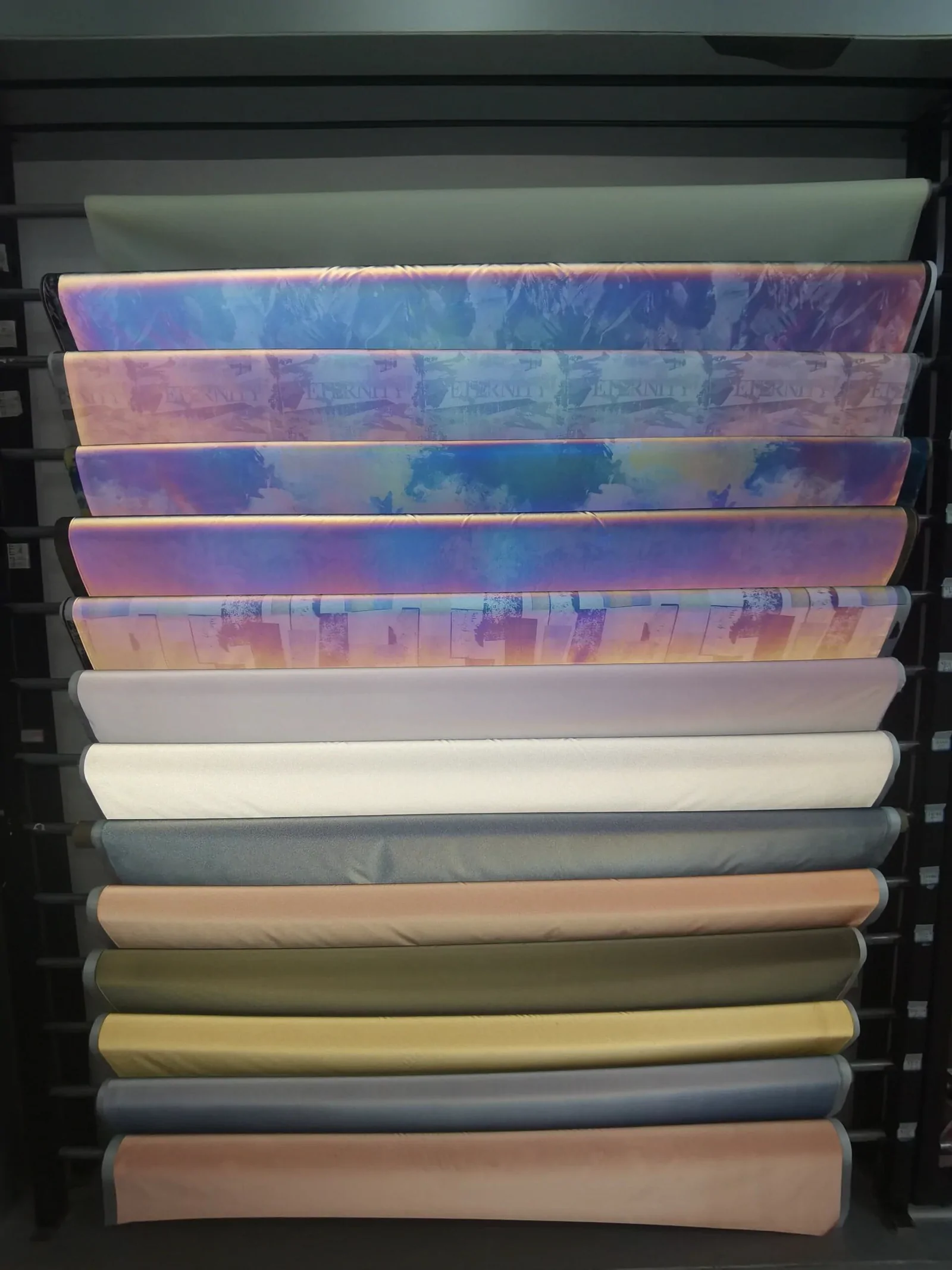 Material rolls with varied reflective surface effects